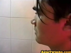 Asian twunk enjoys stroking his unshaven shaft in bathroom
