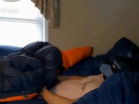 Humping big orange parka on puffy bed of down