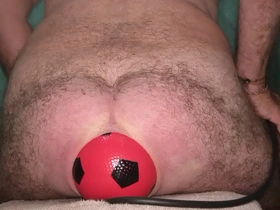 World record 13 cm wide anal stretching with inflatable ball.