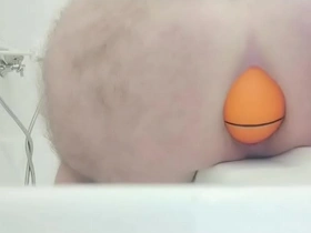 Huge 12cm wide soccer ball slides out of my ass on side of bath.