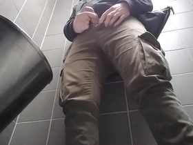 Young man with uncut dick peeing in a public urinal. he then shows and shakes his dick.