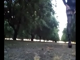 Crossdresser walking in the almond orchard