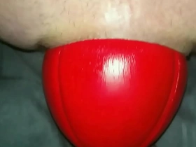Huge 12 cm wide red football sliding out of my ass up close in slow motion