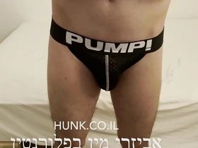 An israeli gay man measures the bottom of a gay store in tel aviv